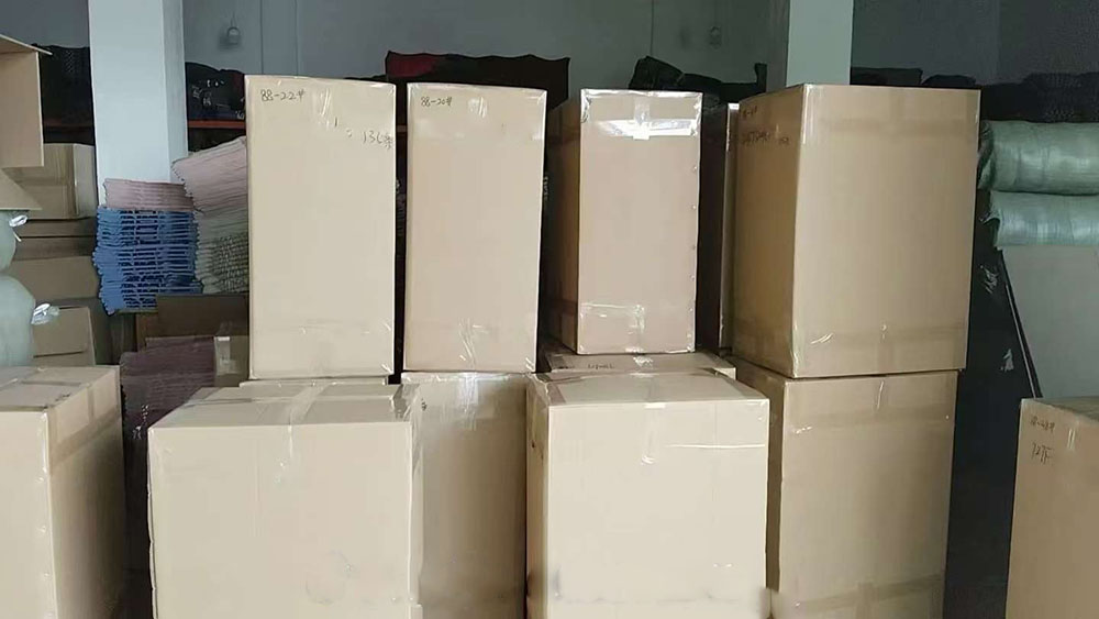2000 knitted scarves boxed and shipped to UK