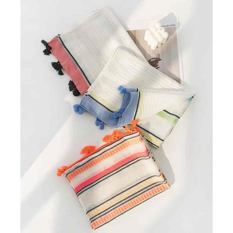 Striped scarves go with everything from commuter fashions to fringed necks to sweet shawls