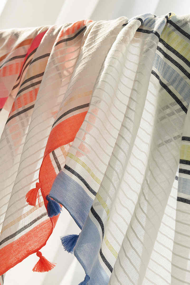Striped scarves go with everything from commuter fashions to fringed necks to sweet shawls