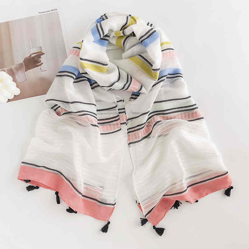 Striped scarves go with everything from commuter fashions to fringed necks to sweet shawls