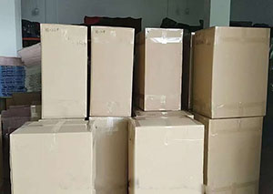 2000 knitted scarves boxed and shipped to UK